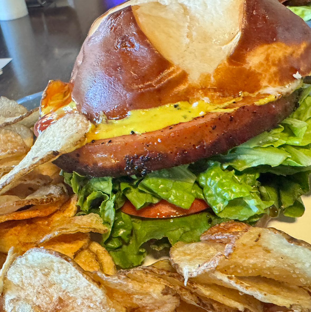 Fried Garlic Bologna On Pretzel Bun.
